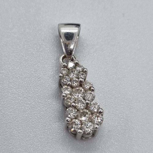 241 - 18ct white gold Iliana diamond cluster pendant together with a pair of costume earrings.   (B.P. 21%... 