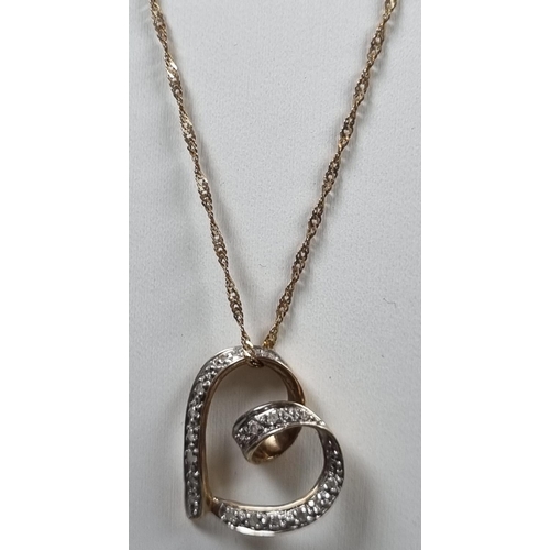 246 - 9ct gold diamond heart shaped pendant on a 9ct gold chain.  2.4g approx.   (B.P. 21% + VAT)