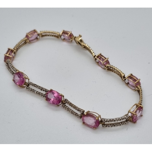 251 - 9ct gold pink nine stone bracelet.  7.7g approx.   (B.P. 21% + VAT)