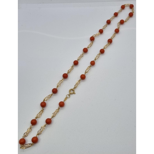 255 - 18ct gold and coral necklace.  12.5g approx.   (B.P. 21% + VAT)