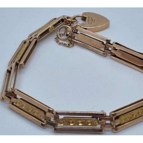 262 - 9ct rose gold three bar gate bracelet with heart padlock.  11.5g approx.   (B.P. 21% + VAT)