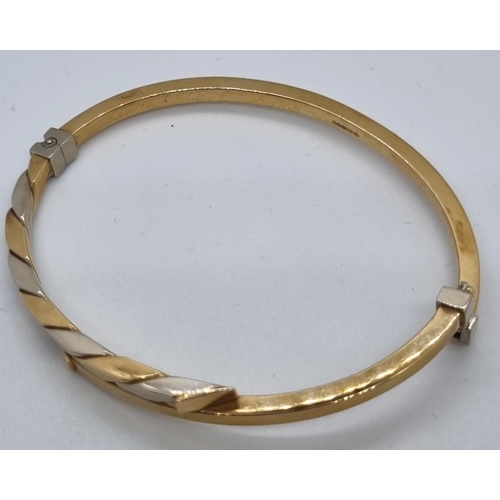 264 - 9ct gold bicolour ladies bangle in fitted box.  7.4g approx.   (B.P. 21% + VAT)