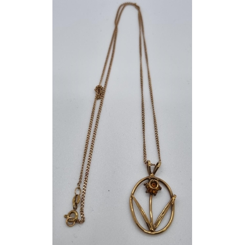 269 - 9ct gold Daffodil pendant and chain.  4.2g approx.  (B.P. 21% + VAT)