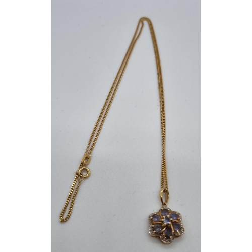 270 - 9ct gold with flowerhead pendant.  5.4g approx.   (B.P. 21% + VAT)