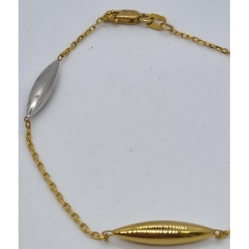 276 - 9ct gold and silver oval design bracelet.  2g approx.  In Burgess Jewellers box.   (B.P. 21% + VAT)