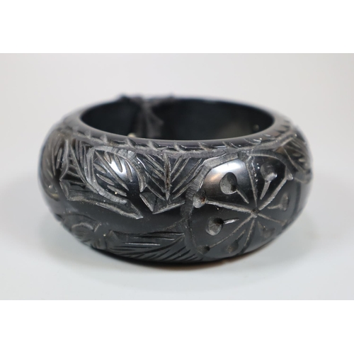 303 - Whitby Jet carved bangle.  (B.P. 21% + VAT)