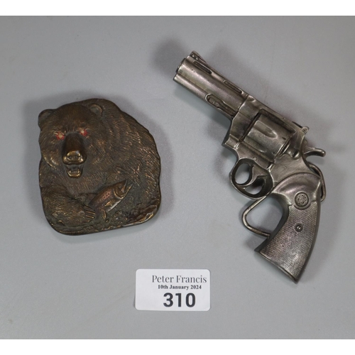 310 - Belt buckle in the form of a revolver by Bergamot and a yellow metal belt buckle in form of a Grizzl... 