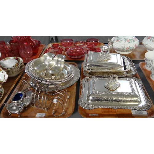 337 - Two trays of silver plate to include: blue glass lined cruet items, toast racks, gravy boats, oval a... 