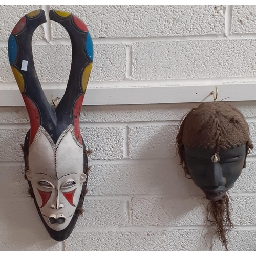 412 - Collection of West African and African tribal masks with hand painted and beaded decoration. (4)
(B.... 