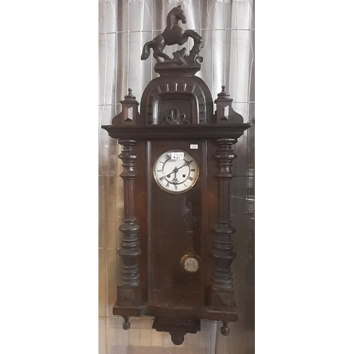 421 - Two similar early 20th Century walnut Vienna type wall clocks, single and two train. The two train w... 