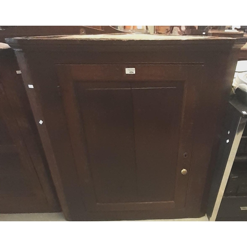 434 - 19th century oak single door blind panelled hanging corner cupboard, the interior revealing three sh... 