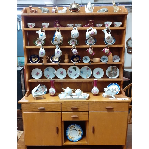 445 - Modern miniature dog kennel dresser with various Limoges miniature china ornaments.
(B.P. 21% + VAT)