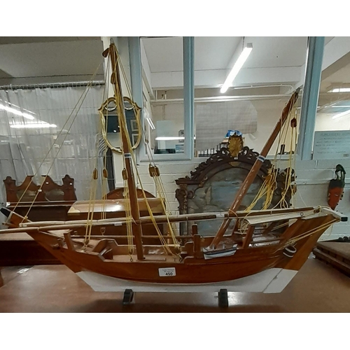 450 - Modern wooden painted model of a sailing ship on stand.  (B.P. 21% + VAT)