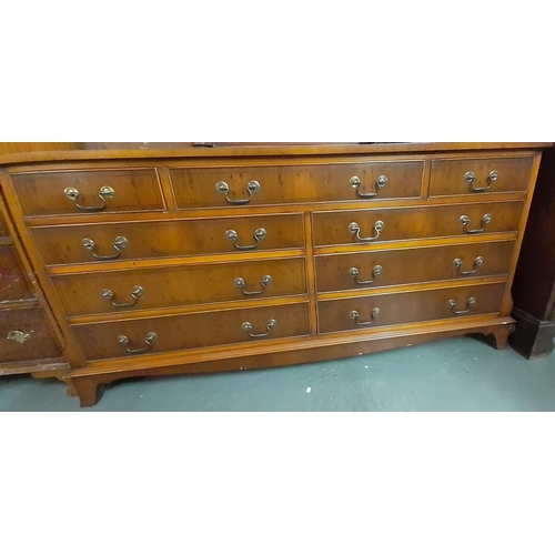 455 - Reproduction yew wood sideboard with an arrangement of nine drawers together with a reproduction nar... 