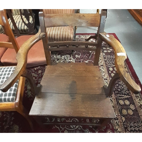 471 - Early 19th century oak bobbin and rail back open farmhouse armchair.    (B.P. 21% + VAT)