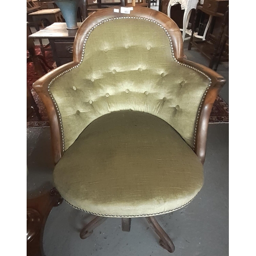 482 - Unusual mahogany framed upholstered button back club style chair with scroll decorated cast iron bas... 