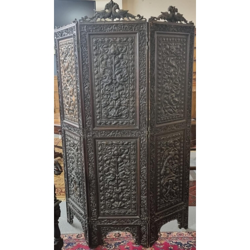 506 - 19th century Indian hardwood framed three fold screen with copper repoussé panels depicting birds am...