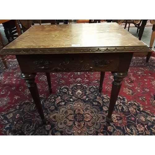 521 - Victorian oak lowboy, the moulded top above a single drawer with ornate handles and carved initials ... 