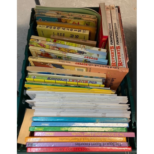 536 - Four crates of assorted books to include: various Rupert Bear annuals and books; Rupert Colour Adven... 