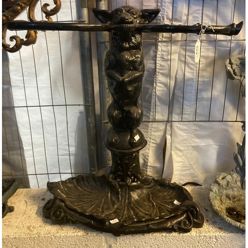 549 - Cast iron Coalbrookdale style stick stand of seated dog and a tree design together with cast metal s... 