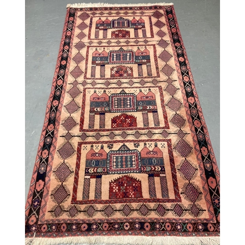 566 - Unique Persian Nomadic pink ground rug with repeating floral and lozenge designs.  216x108cm approx.... 