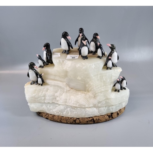 90 - Unusual sculpture of penguins on ice made from quartz on a cork base.  (B.P. 21% + VAT)