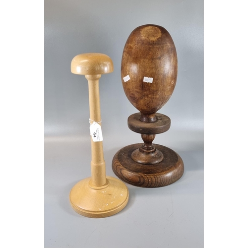 94 - Vintage milliners turned wooden hat block, together with another modern beech hat block or stand. (2... 