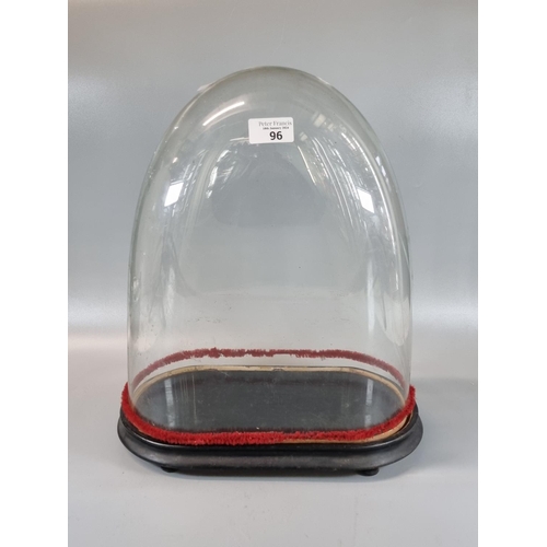 96 - Victorian glass dome on ebonised wooden base. 43cm high approx. 
(B.P. 21% + VAT)