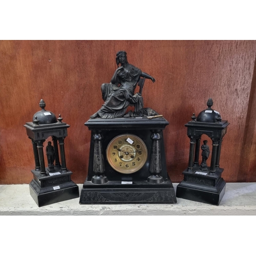 97 - 19th century black slate architectural two train mantle clock garniture with figural pediment and tw... 