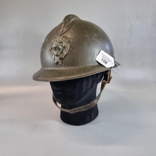 108 - WWII French design Adrian steel helmet with Belgian Army lions head crest.  With lining and chin str... 