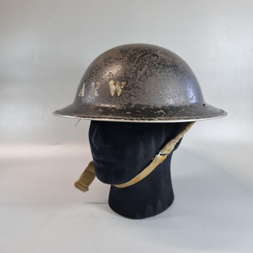 109 - WWII period British design Brodie steel helmet with painted ARW motif stencilled to the front (Air R... 