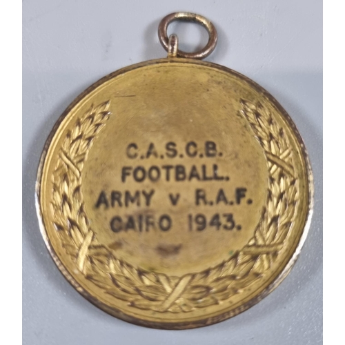 138 - WWII period Army versus RAF football gilt match winner's medallion, Cairo, dated 1943, together with... 