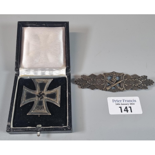 141 - WWII period German Iron Cross first class in original fitted box. Together with another replica badg... 