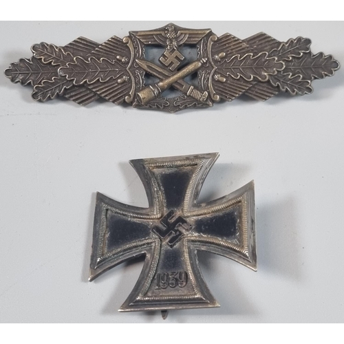 141 - WWII period German Iron Cross first class in original fitted box. Together with another replica badg... 