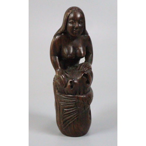 187 - Japanese carved wooden Netsuke in the form of a mermaid curled around a rock.  Inset mother of pearl... 