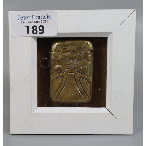 189 - Art Nouveau design embossed originally plated brass vesta case.  In small framed glazed case.  Prove... 