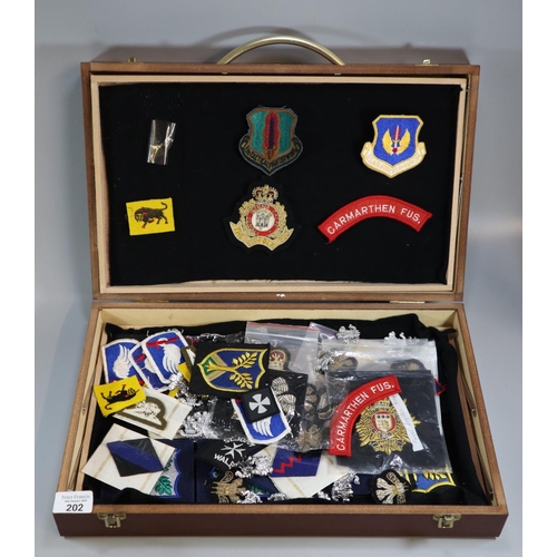 202 - Collection of assorted military patches, blazer badges and cap badges, including: US Air Forces in E... 