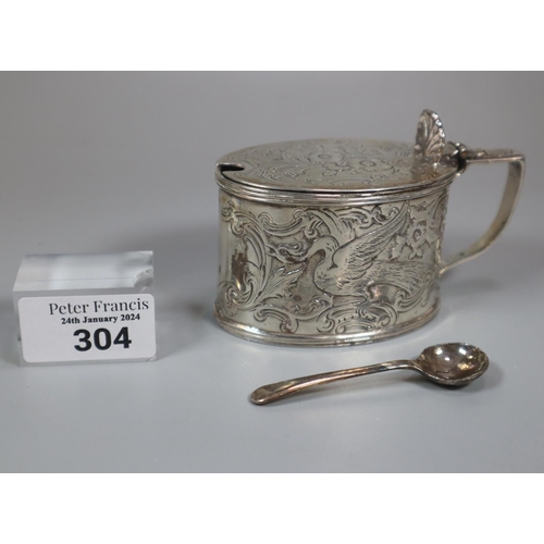 304 - Late Victorian silver mustard pot with Bristol Blue glass liner, overall decorated with repoussé exo... 