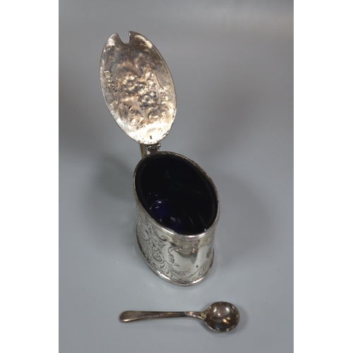 304 - Late Victorian silver mustard pot with Bristol Blue glass liner, overall decorated with repoussé exo... 