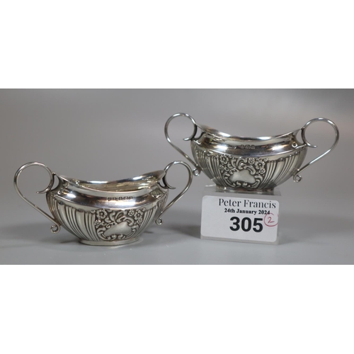 305 - Pair of Edwardian silver two handled boat shaped salts.  Birmingham hallmarks 1902.  1.65 troy oz ap... 