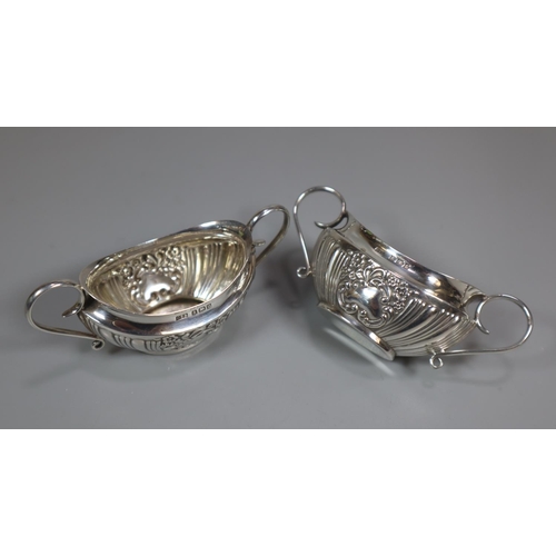 305 - Pair of Edwardian silver two handled boat shaped salts.  Birmingham hallmarks 1902.  1.65 troy oz ap... 