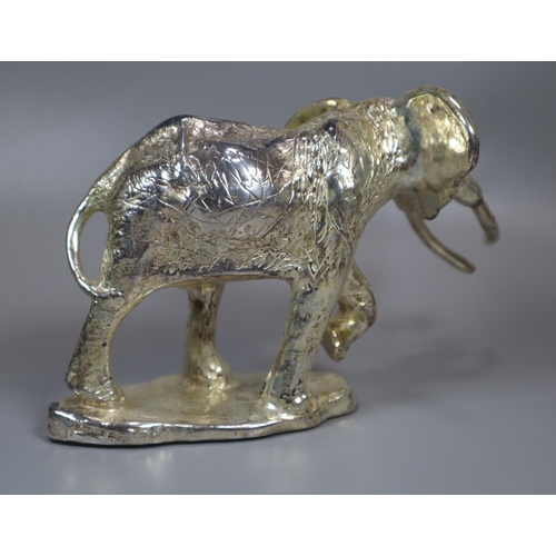 308 - Silver filed  model of an elephant on loaded base.  (B.P. 21% + VAT)