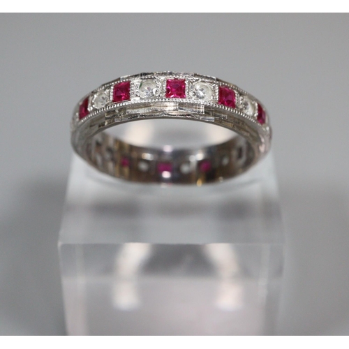 322 - 18ct white gold diamond and ruby eternity ring.  5g approx.  Size P.  (B.P. 21% + VAT)