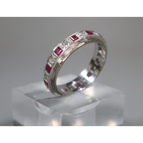 322 - 18ct white gold diamond and ruby eternity ring.  5g approx.  Size P.  (B.P. 21% + VAT)