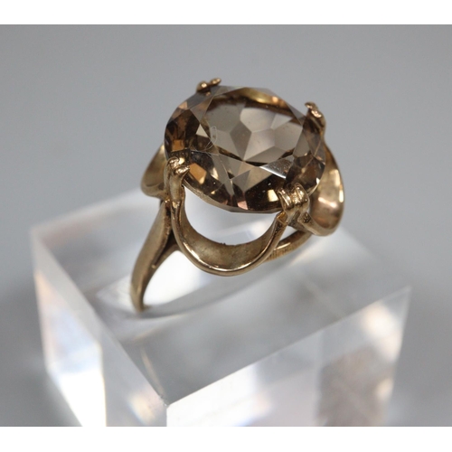 329 - 9ct gold smoky quartz dress ring.  3.2g approx.  Size K1/2.  (B.P. 21% + VAT)