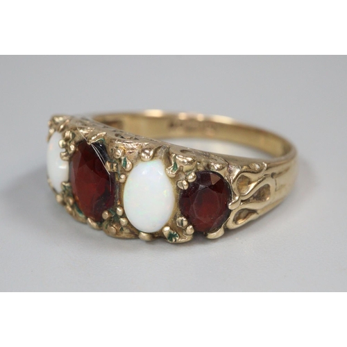 330 - 9ct gold five stone ruby and opal ring.  3g approx.  Size P.   (B.P. 21% + VAT)