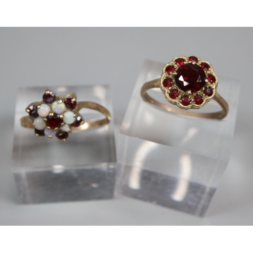 344 - 9ct gold garnet flowerhead ring.  2.8g approx.  Size O.  Together with 9ct gold opal and ruby or gar... 