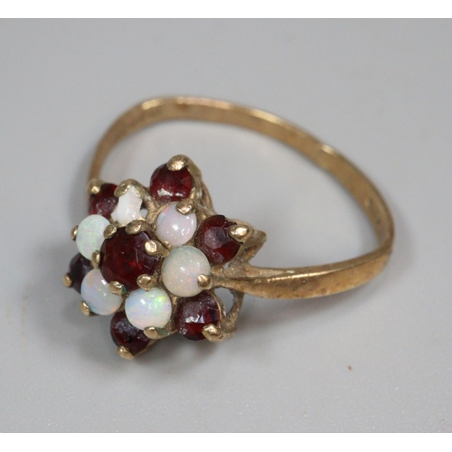 344 - 9ct gold garnet flowerhead ring.  2.8g approx.  Size O.  Together with 9ct gold opal and ruby or gar... 