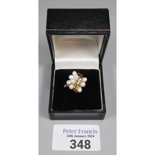 348 - 9ct gold modernist design diamond and pearl ring.  3.2 g approx.  Size N1/2.  (B.P. 21% + VAT)