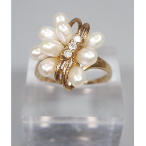 348 - 9ct gold modernist design diamond and pearl ring.  3.2 g approx.  Size N1/2.  (B.P. 21% + VAT)